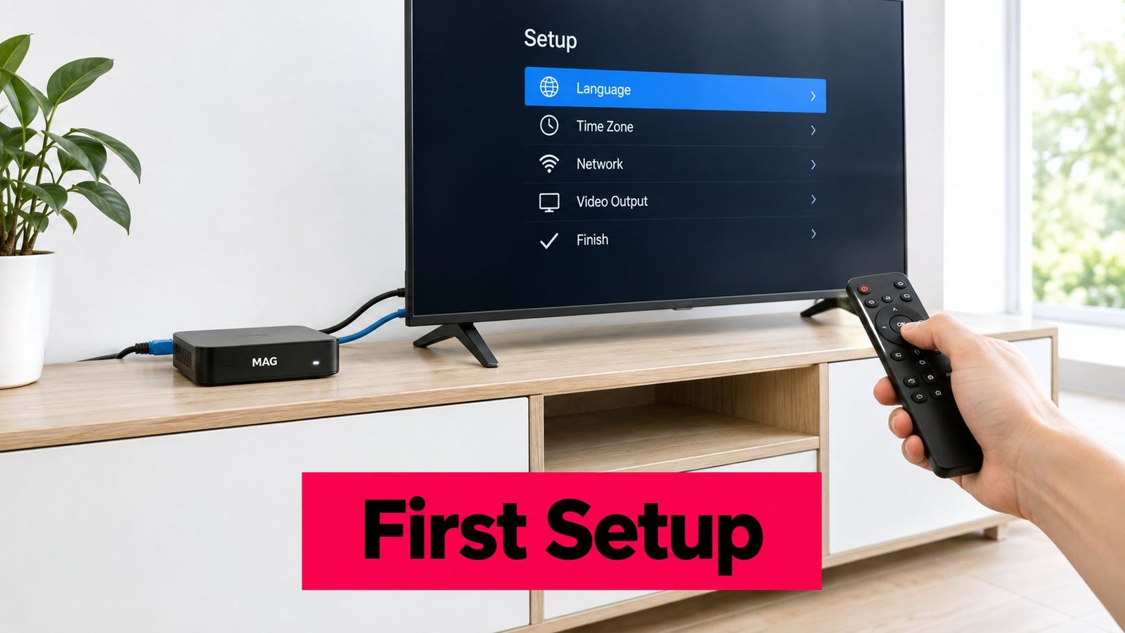 A hand holding a remote control pointing at a television screen showing the initial system setup menu.